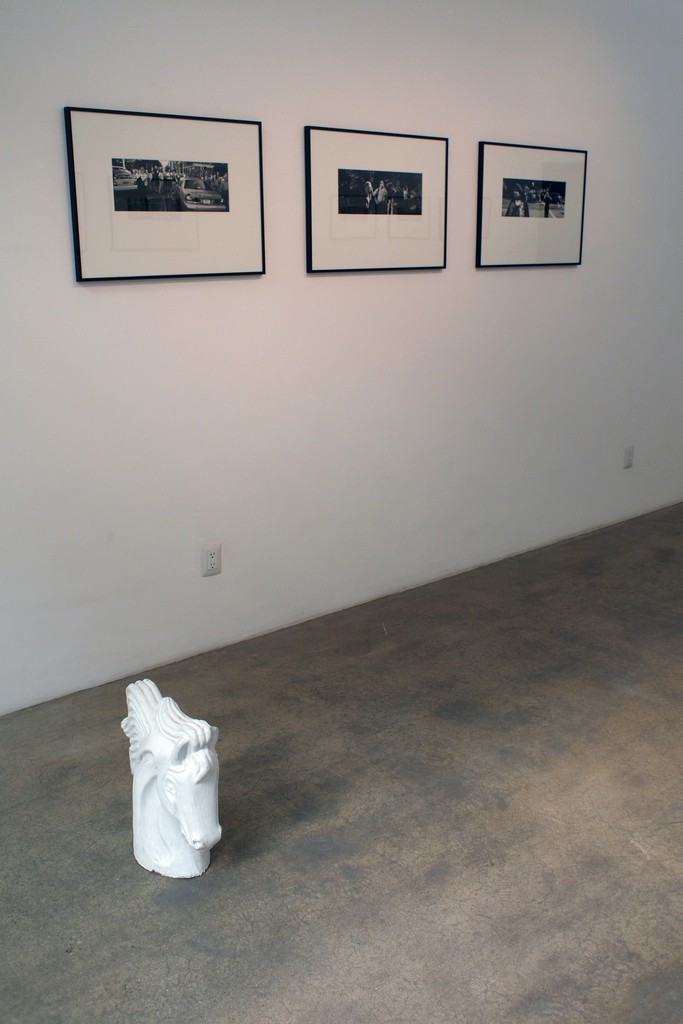 Three fiber based gelatin silver prints of the 9/11 series, with a plaster sculpture of a horse's head an object that is a frequent ornament in the facade of houses commissioned by immigrants, and is part of the "Arquitectura libre" (Free architecture). All located in the main room of the gallery Three fiber based gelatin silver prints of the 9/11 series, with a plaster sculpture of a horse's head an object that is a frequent ornament in the facade of houses commissioned by immigrants, and is part of the "Arquitectura libre" (Free architecture). All located in the main room of the gallery