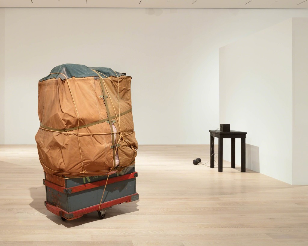Christo, Dolly, 1964 Wooden box, tarpaulin, polyethylene, rope, girth, and metal wheels. Courtesy the artist. Joseph Beuys, Tisch mit Aggregat (Table with Accumulator), 1958–85. Bronze, wire cables. Courtesy Galerie Thaddaeus Ropac, London, Paris, and Salzburg. Installation view: "The Everywhere Studio," Institute of Contemporary Art, Miami, Dec 1, 2017–Feb 26, 2018. Photo: Fredrik Nilsen Studio. Christo, Dolly, 1964 Wooden box, tarpaulin, polyethylene, rope, girth, and metal wheels. Courtesy the artist. Joseph Beuys, Tisch mit Aggregat (Table with Accumulator), 1958–85. Bronze, wire cables. Courtesy Galerie Thaddaeus Ropac, London, Paris, and Salzburg. Installation view: "The Everywhere Studio," Institute of Contemporary Art, Miami, Dec 1, 2017–Feb 26, 2018. Photo: Fredrik Nilsen Studio.