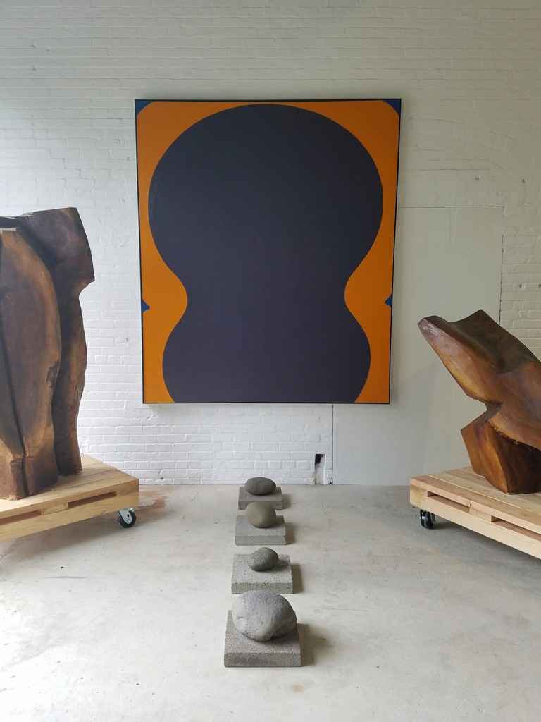 Painting by Al Held. Stone floor sculpture by Carl Andre. Painting by Al Held. Stone floor sculpture by Carl Andre.