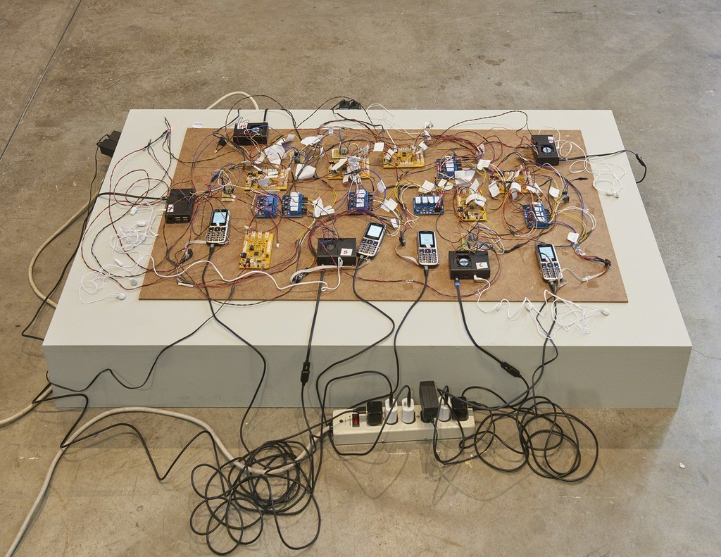 Shadi Habib Allah, Did you see me this time, with your own eyes?, 2018, detail, 74 million million million tons, SculptureCenter, New York, 2018. Raspberry Pi computers, Z-Line phones and chargers, microcontrollers, video with sound. Dimensions variable. Courtesy the artist, Green Art Gallery, Dubai and Rodeo, London. Photo: Kyle Knodell Shadi Habib Allah, Did you see me this time, with your own eyes?, 2018, detail, 74 million million million tons, SculptureCenter, New York, 2018. Raspberry Pi computers, Z-Line phones and chargers, microcontrollers, video with sound. Dimensions variable. Courtesy the artist, Green Art Gallery, Dubai and Rodeo, London. Photo: Kyle Knodell