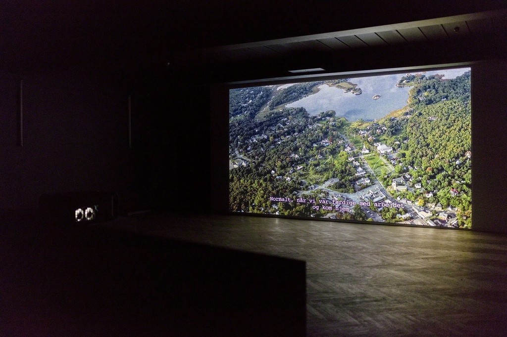 Omer Fast, "5,000 Feet is the Best", 2011. HD Video, 30.00 min. Installation view from 'Whistleblowers & Vigilantes', Kunsthal Charlottenborg, 2017. Courtesy of the artist, Arratia Beer, Berlin and gb agency, Paris. Photo by Anders Sune Berg. Omer Fast, "5,000 Feet is the Best", 2011. HD Video, 30.00 min. Installation view from 'Whistleblowers & Vigilantes', Kunsthal Charlottenborg, 2017. Courtesy of the artist, Arratia Beer, Berlin and gb agency, Paris. Photo by Anders Sune Berg.