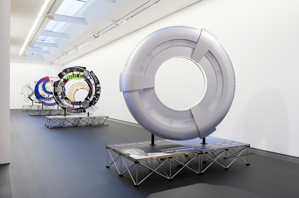 "Simon Denny: Products for Organising.” Installation view, Serpentine Sackler Gallery. 25 November 2015 - 14 February 2016. Photograph © 2015 readsreads.info "Simon Denny: Products for Organising.” Installation view, Serpentine Sackler Gallery. 25 November 2015 - 14 February 2016. Photograph © 2015 readsreads.info