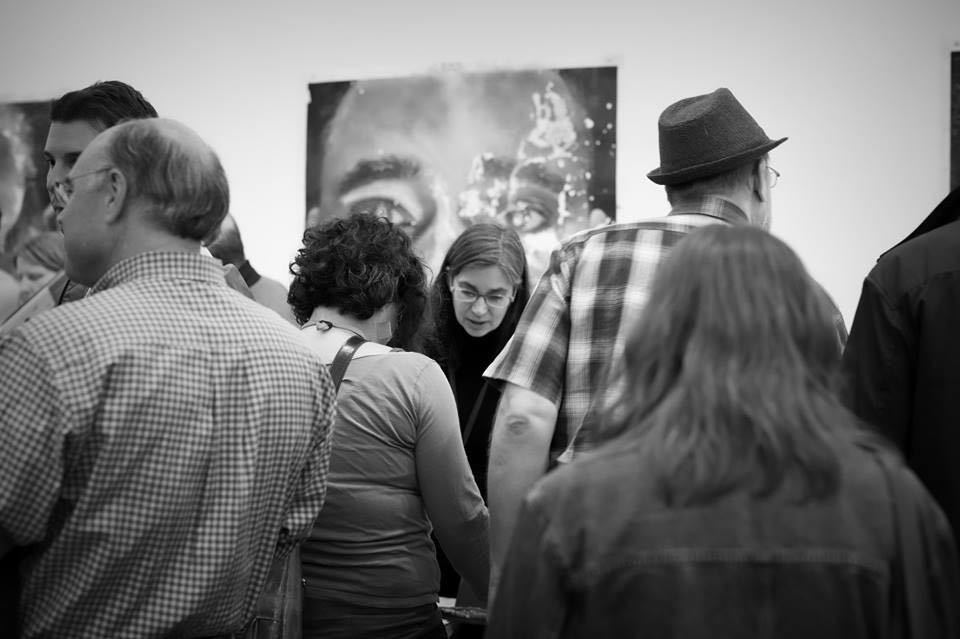 Photograph by Constance Brinkley, Michelle Dunn Marsh selling books at Photolucida, 2017 Photograph by Constance Brinkley, Michelle Dunn Marsh selling books at Photolucida, 2017