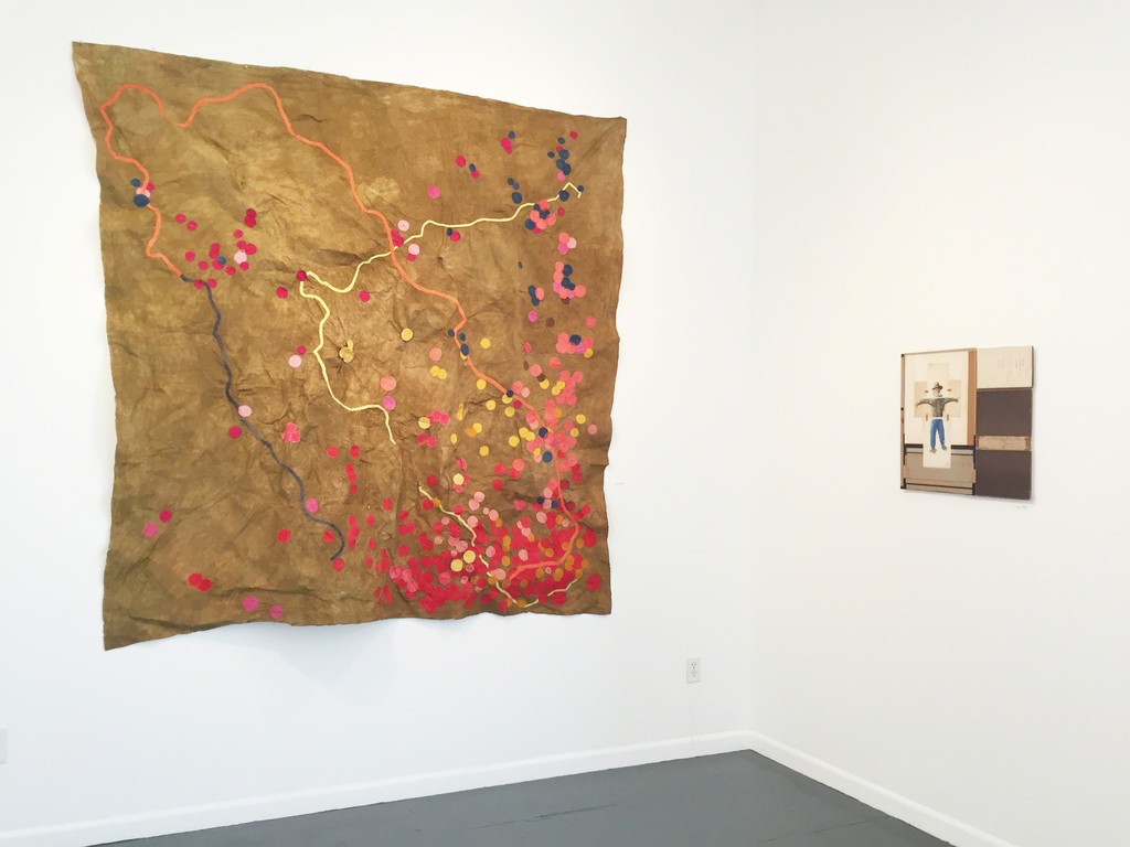 Aida Gamez translates a map of border crossing deaths into a striking thing of beauty in "Inhumane Border," shown next to McClain's "Scarecrow." Aida Gamez translates a map of border crossing deaths into a striking thing of beauty in "Inhumane Border," shown next to McClain's "Scarecrow."