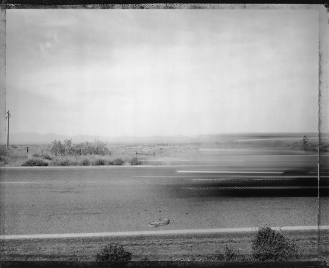 Mark Klett, ‘Car Passing Snake ’, Photography, Pigment Ink Print, photo-eye Gallery