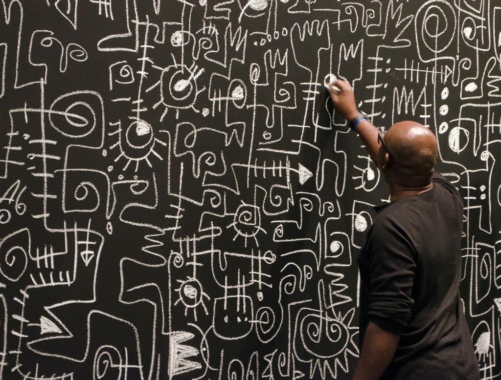 Artist Victor Ekpuk creates his site-specific "Drawing Memory" as part of the exhibition "Sixfold Symmetry: Pattern in Art and Science," Tang Teaching Museum, September 16, 2016 Artist Victor Ekpuk creates his site-specific "Drawing Memory" as part of the exhibition "Sixfold Symmetry: Pattern in Art and Science," Tang Teaching Museum, September 16, 2016