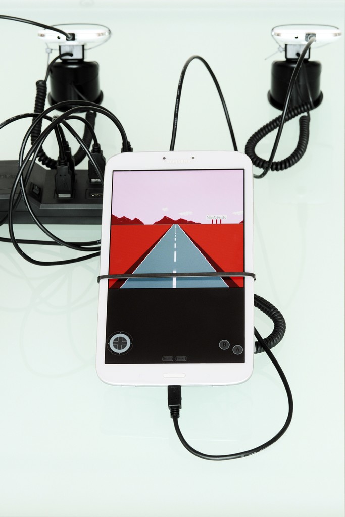 QuickOffice (detail), 2015
Samsung Galaxy Tab 3 (SM-T310), three BLU Advance
4.0 3G (A260a) cell phones, Newisland N9000 Quad
Core H20 cell phone, cell phone display security
devices, table, cable ties, Super Mario Clouds
(2002-) & F1 Racer (2004) aka Super Landscape #1
(2005) Nintendo Entertainment System .nes Roms,
Android OS Nintendo Entertainment System
emulators
Dimensions variable
Courtesy of the artist and Espace Louis Vuitton
München
Photo: Christian Kain QuickOffice (detail), 2015
Samsung Galaxy Tab 3 (SM-T310), three BLU Advance
4.0 3G (A260a) cell phones, Newisland N9000 Quad
Core H20 cell phone, cell phone display security
devices, table, cable ties, Super Mario Clouds
(2002-) & F1 Racer (2004) aka Super Landscape #1
(2005) Nintendo Entertainment System .nes Roms,
Android OS Nintendo Entertainment System
emulators
Dimensions variable
Courtesy of the artist and Espace Louis Vuitton
München
Photo: Christian Kain