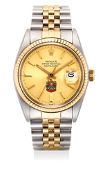 A fine and rare two-tone stainless steel and yellow gold wristwatch with date, sweep center seconds, bracelet, warranty and presentation box, dial with emblem of Abu Dhabi