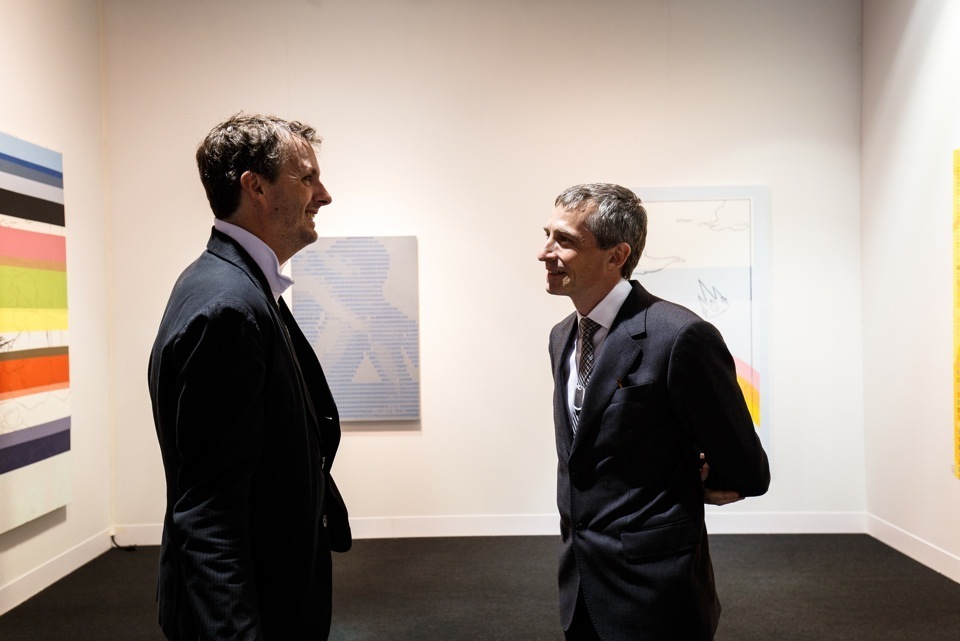 Artist Jack Featherly and gallery owner Theo Downes-Le Guin chat before the fair preview. Image courtesy David Willems Photography. Artist Jack Featherly and gallery owner Theo Downes-Le Guin chat before the fair preview. Image courtesy David Willems Photography.