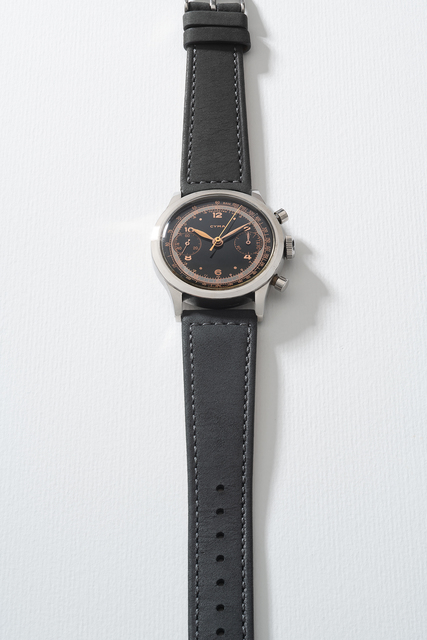 Cyman, ‘A very rare stainless steel chronograph wristwatch with glossy black dial, telemeter and tachymeter scales’, Circa 1950s, Phillips