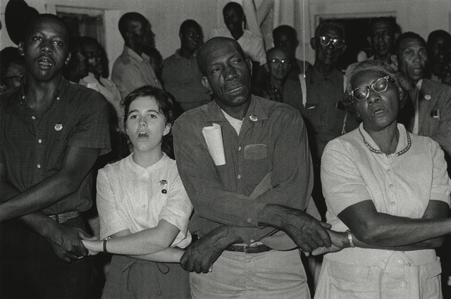 Bob Adelman, ‘"In West Feliciana, an overwhelmingly black parish where no person of color had voted in the twentieth century, volunteer Mimi Feingold urged members of a church congregation to try to vote. She then joined hands with them to sing, 'This Little Light of Mi"’, 1963, Photography, Gelatin silver print; printed later, Howard Greenberg Gallery