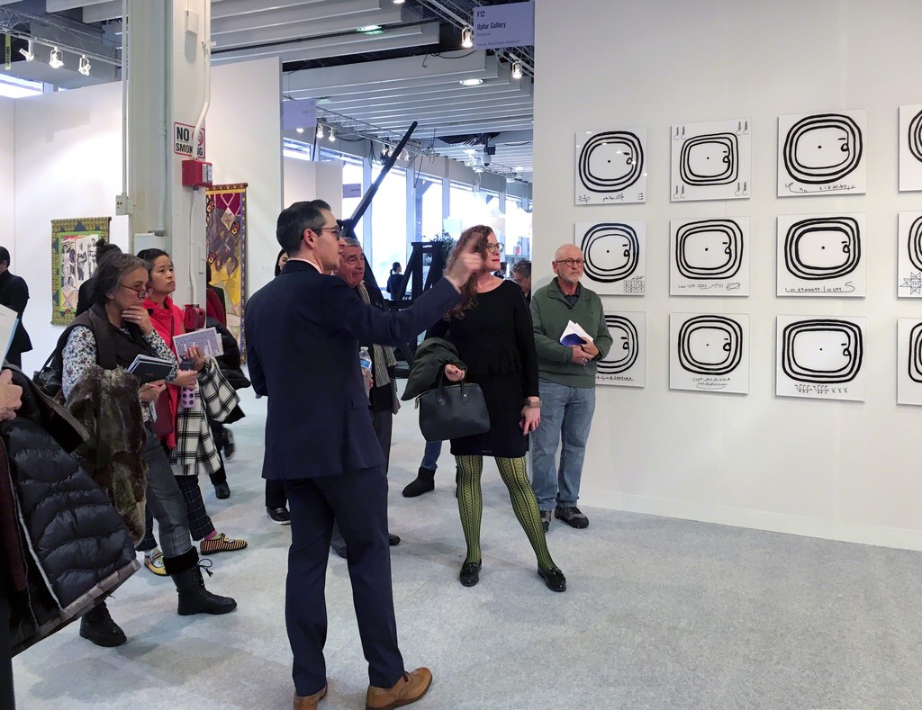 Focus curator Gabriel Ritter discussing Morehshin Allahyari's work with fair-goers. Focus curator Gabriel Ritter discussing Morehshin Allahyari's work with fair-goers.