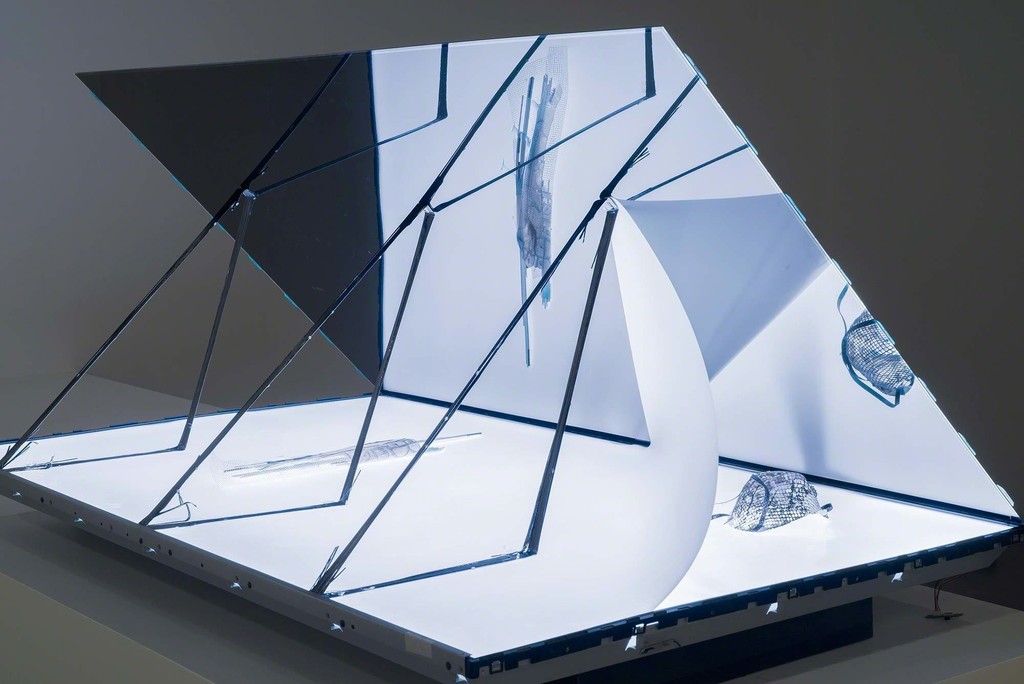 Josh Tonsfeldt, Untitled, 2015, LCD television, digital video, carbon fiber, fiberglass, CFL tubes, dust mask, pigment print on hydrographic film, pigment sink, resin, 30 x 55 x 60 in. / 76.2 x 139.7 x 152.4 cm., exhibition view, Simon Preston Gallery, New York Josh Tonsfeldt, Untitled, 2015, LCD television, digital video, carbon fiber, fiberglass, CFL tubes, dust mask, pigment print on hydrographic film, pigment sink, resin, 30 x 55 x 60 in. / 76.2 x 139.7 x 152.4 cm., exhibition view, Simon Preston Gallery, New York