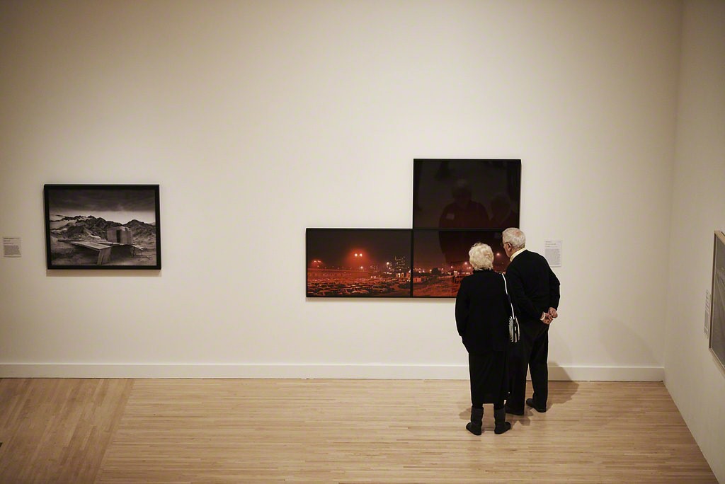 Guests taking a closer look at Lewis Baltz's 1989 work "Piazza Sigmund Freud" at the Fall 2017 Open House.
Photo credit: Jonathan Wanderweit. Guests taking a closer look at Lewis Baltz's 1989 work "Piazza Sigmund Freud" at the Fall 2017 Open House.
Photo credit: Jonathan Wanderweit.