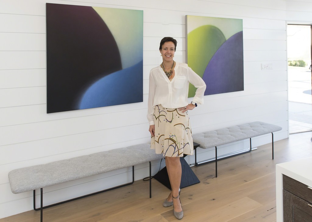 Esperanza Leon, curator, with Maria Schon paintings Esperanza Leon, curator, with Maria Schon paintings