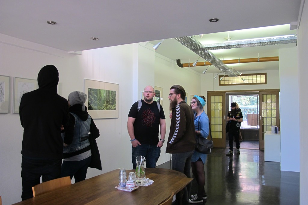 Installation overview with visitors during Roadburn Festival for the solo exhibition 'Brilliant Shadows' by Arik Roper. Installation overview with visitors during Roadburn Festival for the solo exhibition 'Brilliant Shadows' by Arik Roper.