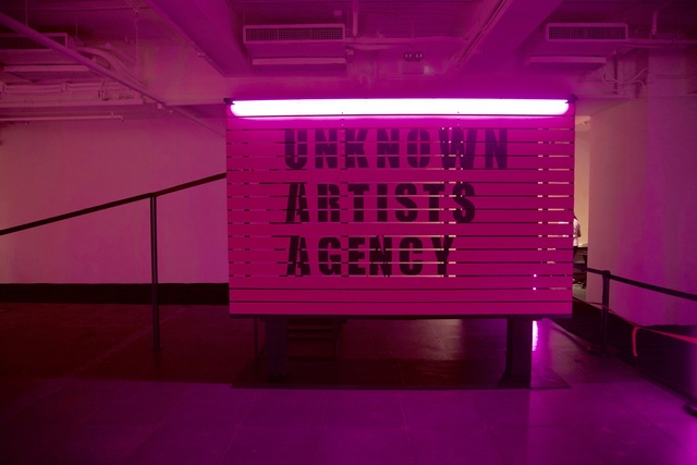 Wang Xin, ‘Unknown Artists Agency’, 2017, Installation, Iron, acrylic, spray paint, LED Lights, LED board, plastic box, desk, 46 inch LED TV, receipt printer, journal, plastic balls, paper, stanchions, rope, shelf, felt, de Sarthe Gallery