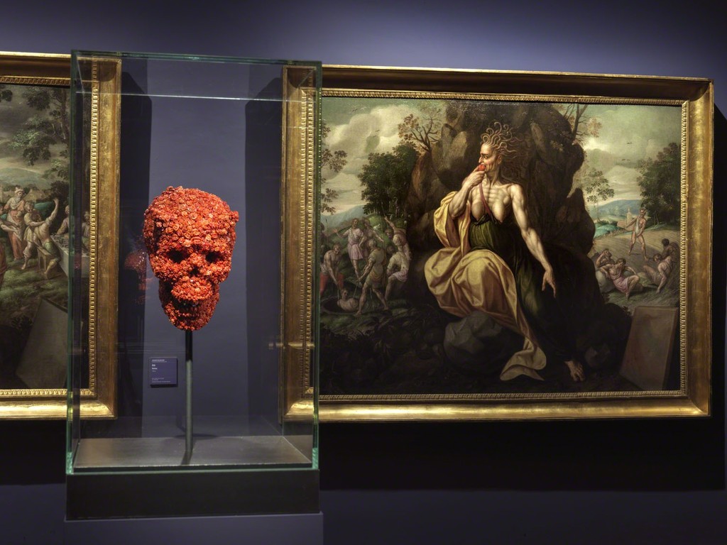 "The Devilish Love for Death", one of the works of the the triptych of coral sculptures composed also by "The Devilish Passion" and "The Devilish Bridge between Life and Dead", 2019, deep precious coral, pigment, polymere. In the background "Envy" by Jacques de Backer from the series "The Seven Deadly Sins", Farnese Collection. "The Devilish Love for Death", one of the works of the the triptych of coral sculptures composed also by "The Devilish Passion" and "The Devilish Bridge between Life and Dead", 2019, deep precious coral, pigment, polymere. In the background "Envy" by Jacques de Backer from the series "The Seven Deadly Sins", Farnese Collection.