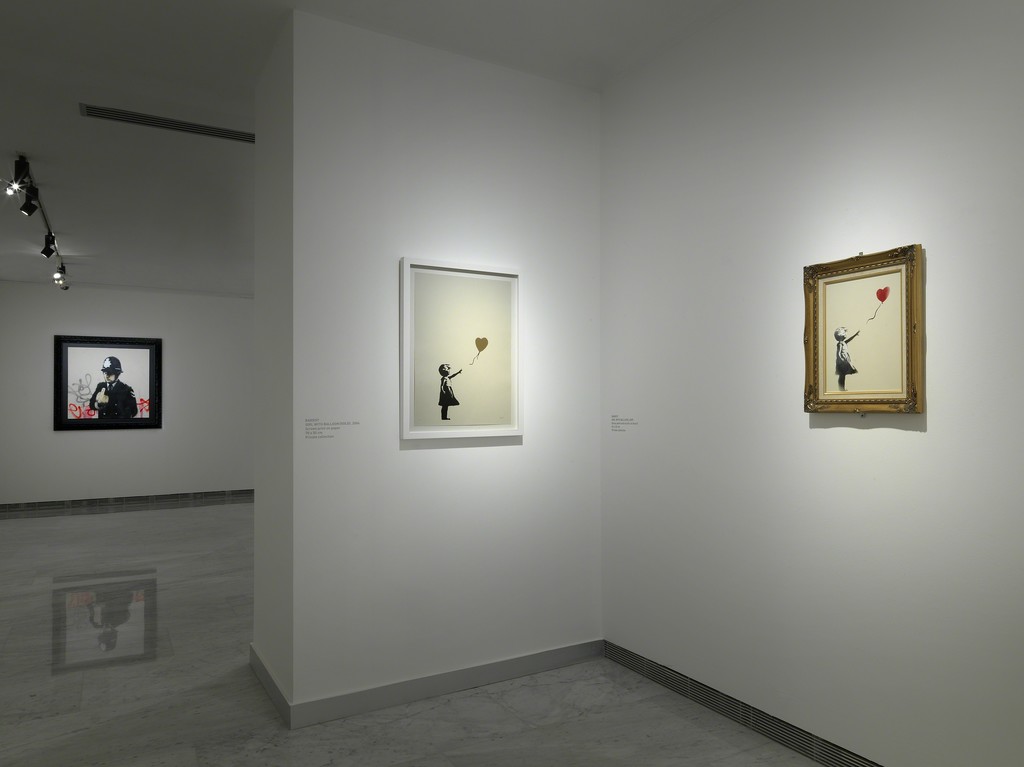Banksy's 'Girl With Red Balloon', is one of his most iconic works, here on display in different formats and versions he's done over the years. Banksy's 'Girl With Red Balloon', is one of his most iconic works, here on display in different formats and versions he's done over the years.