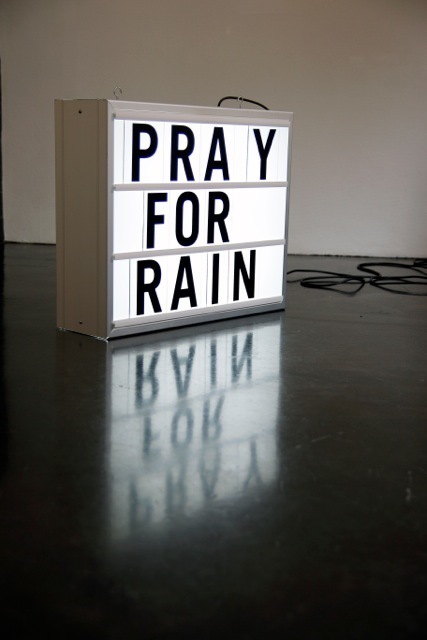 Installation for solo exhibition 'There is Anarchy in our Midst' with 'Pray For Rain' lightbox. Installation for solo exhibition 'There is Anarchy in our Midst' with 'Pray For Rain' lightbox.
