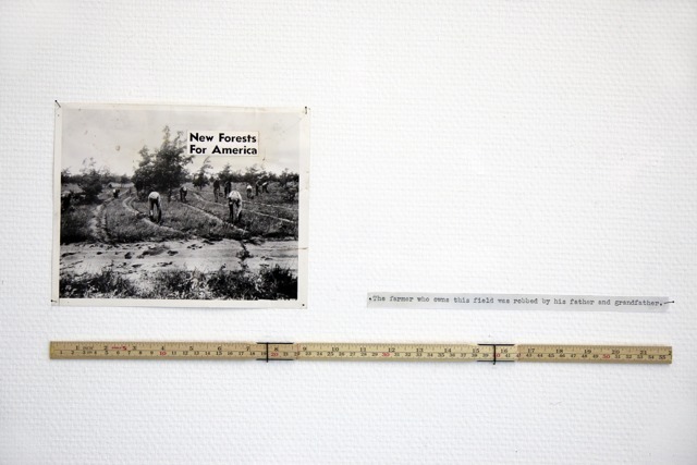 Installation overview with 'New Forests For America'. An installation with an old press image, text cut outs and 22 inches of yardstick. Installation overview with 'New Forests For America'. An installation with an old press image, text cut outs and 22 inches of yardstick.