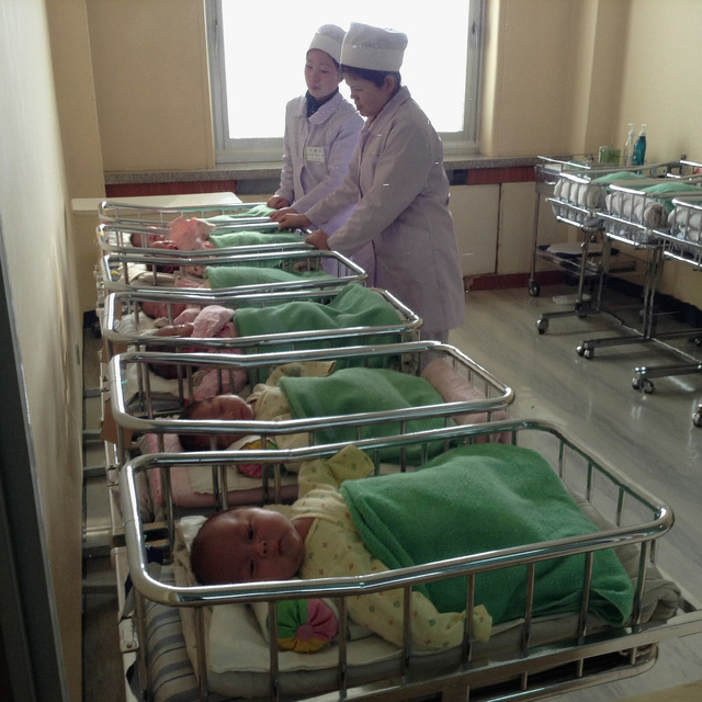 David Guttenfelder North Korean babies rest in a row of cribs at the