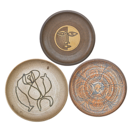 Three stoneware plates