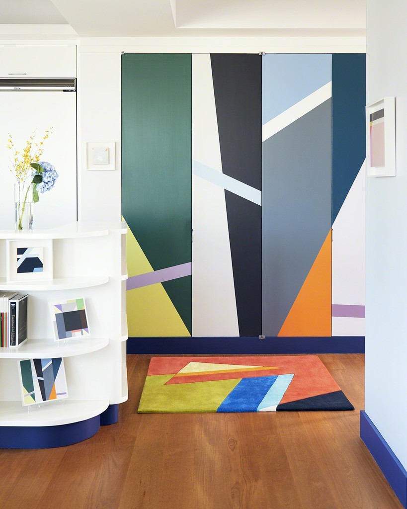 In translating the painting into a rug, Seligson hand-selected the eight colors from hundreds of color poms to ensure precise color matching. The cut-pile rug was hand-tufted in Thailand with pure silk and New Zealand wool. The pencil carving is also cut by hand. Behind the rug are a set of doors that are also translated from one of Seligson's paintings. The artist worked with a housepainter, using a maquette which you can see on the left on the bottom shelf. Door price on request. In translating the painting into a rug, Seligson hand-selected the eight colors from hundreds of color poms to ensure precise color matching. The cut-pile rug was hand-tufted in Thailand with pure silk and New Zealand wool. The pencil carving is also cut by hand. Behind the rug are a set of doors that are also translated from one of Seligson's paintings. The artist worked with a housepainter, using a maquette which you can see on the left on the bottom shelf. Door price on request.