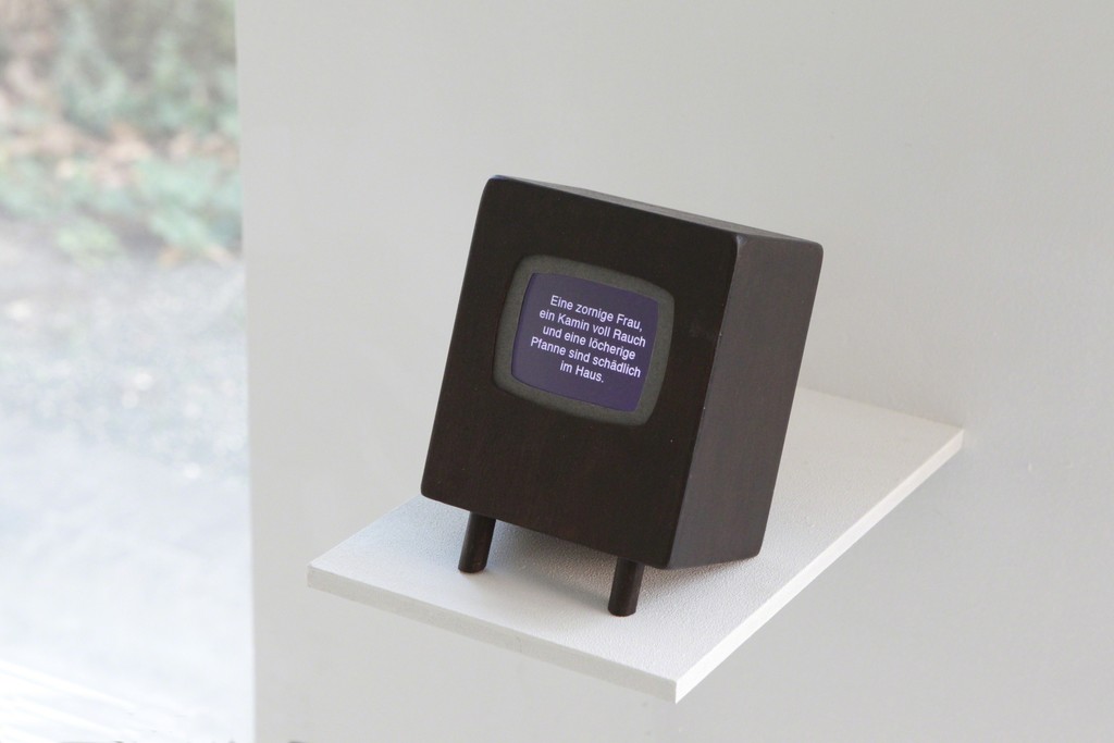 exhibition view: „There is no place like home“, 2012 | wooden object, digital frame with text animation, 16, 5 x 12 x 9,5cm | image: marianne halter exhibition view: „There is no place like home“, 2012 | wooden object, digital frame with text animation, 16, 5 x 12 x 9,5cm | image: marianne halter