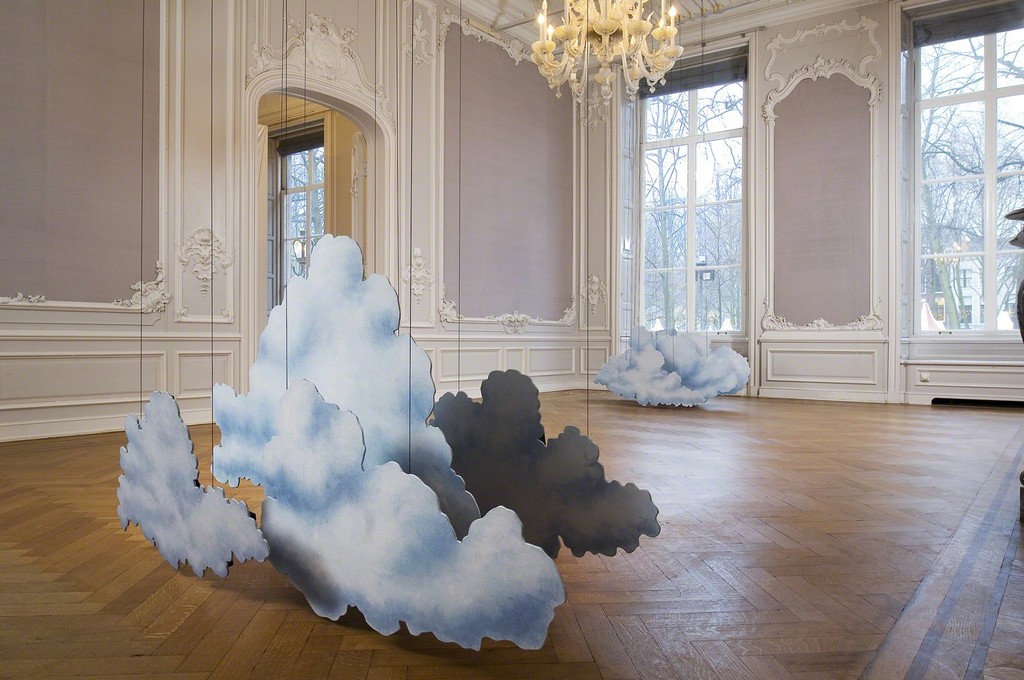 Latifa Echakhch.
Encrage (L'appareil photo Kodak),
2014.
Camera, cover, Chinese ink, wooden cloud scenery, canvas, acrylic paint and steel wire. 500 x 170 x 87 cm Latifa Echakhch.
Encrage (L'appareil photo Kodak),
2014.
Camera, cover, Chinese ink, wooden cloud scenery, canvas, acrylic paint and steel wire. 500 x 170 x 87 cm