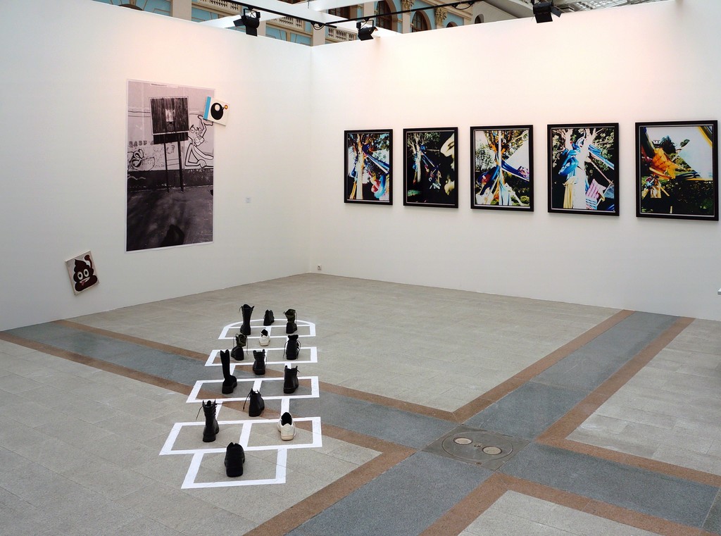 Stand view with Hopscotch installation by Alexandra Galkina (bottom center), Untitled by Alexandra Galkina and Sergei Sapozhnikov (left) and Failed Views series by Sergei Sapozhnikov (right) Stand view with Hopscotch installation by Alexandra Galkina (bottom center), Untitled by Alexandra Galkina and Sergei Sapozhnikov (left) and Failed Views series by Sergei Sapozhnikov (right)