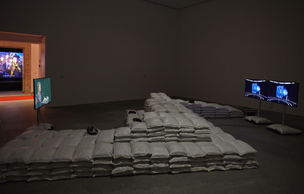 Installation view of "Hito Steyerl: Duty-Free Art" at Museo Nacional Centro de Arte Reina Sofia. November 2015. Photograph: Joaquìn Cortés/Román Lores. Installation view of "Hito Steyerl: Duty-Free Art" at Museo Nacional Centro de Arte Reina Sofia. November 2015. Photograph: Joaquìn Cortés/Román Lores.