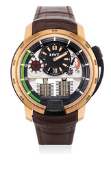 A fine and rare pink gold and titanium semi-skeletonized wristwatch with retrograde fluorescent liquid capillary time indicator, power reserve indicator, international warranty certificate and presentation box