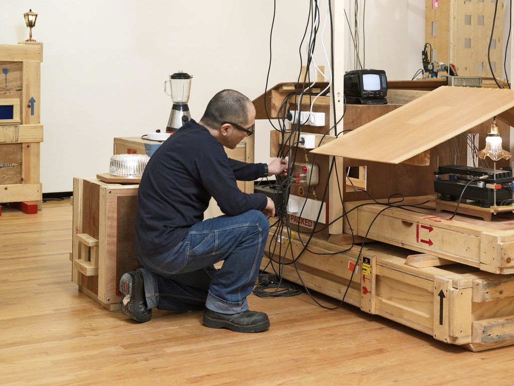 UJINO installing his work, Plywood City, 2008 UJINO installing his work, Plywood City, 2008