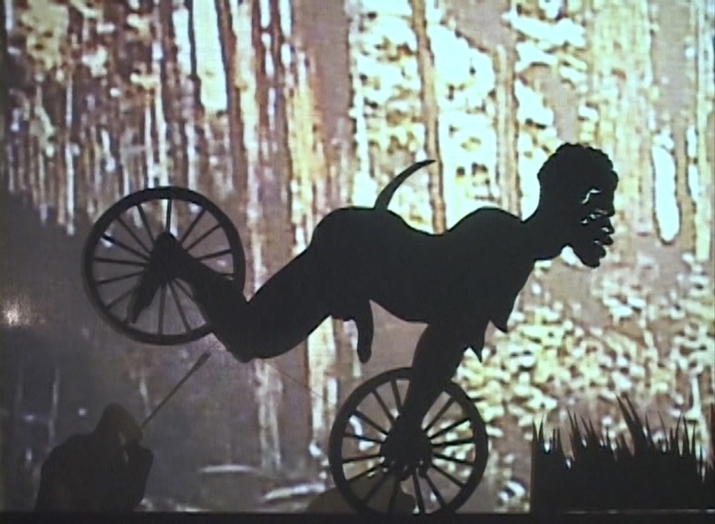 Installation view, Kara Walker, Fall Frum Grace, Miss Pipi's Blue Tale (Film Still), 2011, Video (color, sound);
© Kara Walker, Courtesy Sprüth Magers and Sikkema Jenkins & Co., Photography: Timo Ohler Installation view, Kara Walker, Fall Frum Grace, Miss Pipi's Blue Tale (Film Still), 2011, Video (color, sound);
© Kara Walker, Courtesy Sprüth Magers and Sikkema Jenkins & Co., Photography: Timo Ohler