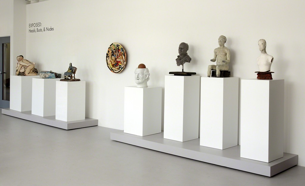 Row of heads, busts, and nudes in a classically-staged exhibit. (Photo by John Polak.) Row of heads, busts, and nudes in a classically-staged exhibit. (Photo by John Polak.)