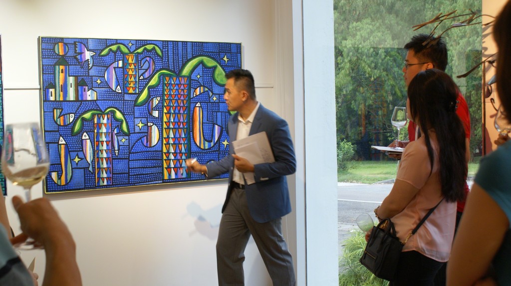 Gallery co-founder Weiren Loh, explains to guests on the significance of Rafael Romero's title work Territorio de Paz. Gallery co-founder Weiren Loh, explains to guests on the significance of Rafael Romero's title work Territorio de Paz.