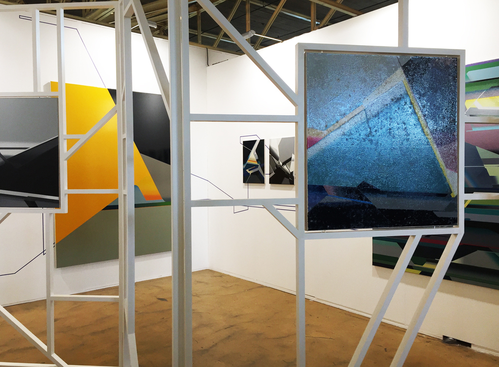 Carrying paintings into the space through the artist's 'Buttress' (system); photo: gallery Carrying paintings into the space through the artist's 'Buttress' (system); photo: gallery