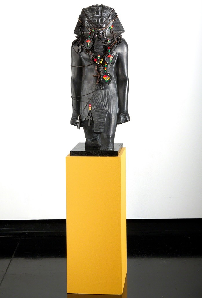 Fred Wilson, "Pharaoh Fetish," 1993, painted plaster, white pigment, leather and cotton cord, wood and glass, Tang Teaching Museum collection, gift of Peter Norton Fred Wilson, "Pharaoh Fetish," 1993, painted plaster, white pigment, leather and cotton cord, wood and glass, Tang Teaching Museum collection, gift of Peter Norton