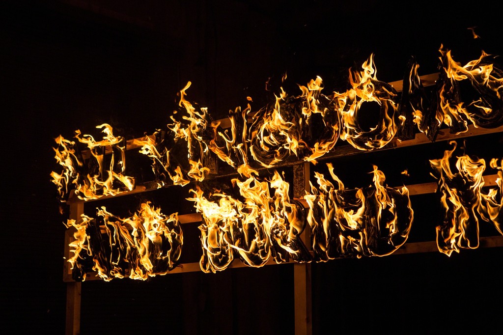 Detail from Robert Montgomery's fire poem "All Kingdoms Smashed and Buried in the Sky". Photography: Antonis Minas Detail from Robert Montgomery's fire poem "All Kingdoms Smashed and Buried in the Sky". Photography: Antonis Minas