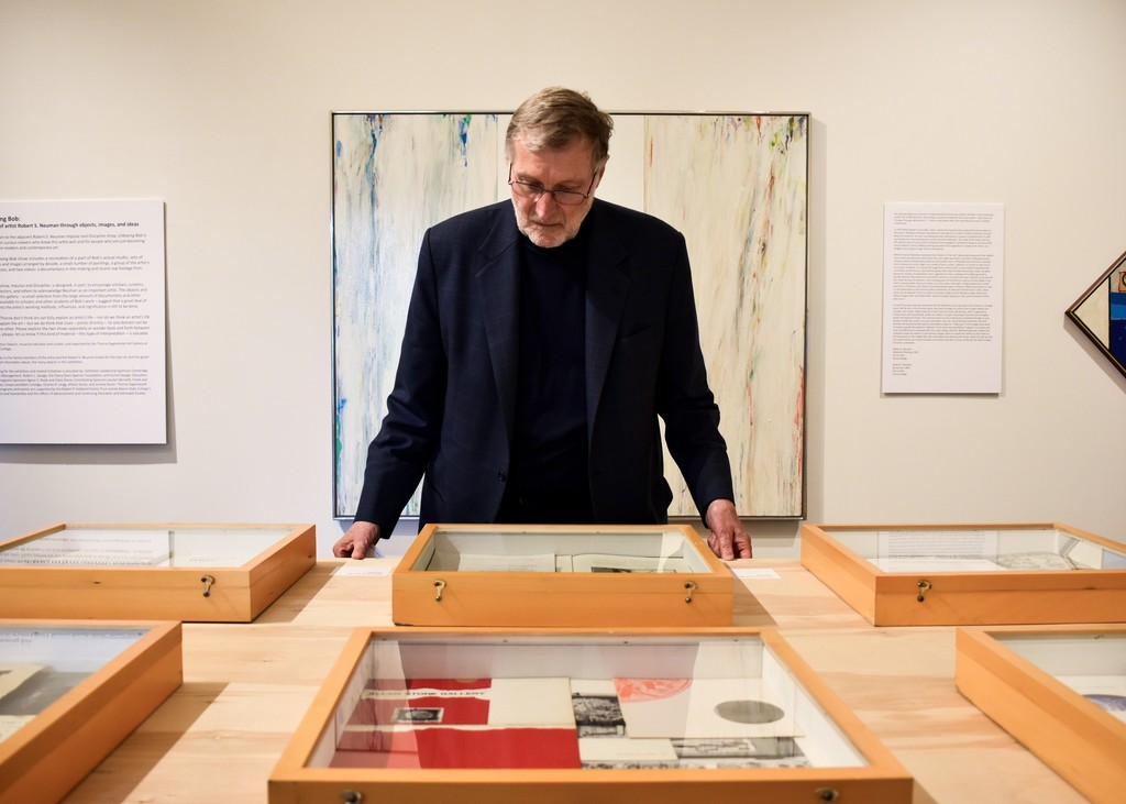 A visitor to "Unboxing Bob" examines private notes and sketches from Robert S. Neuman's early career. A visitor to "Unboxing Bob" examines private notes and sketches from Robert S. Neuman's early career.