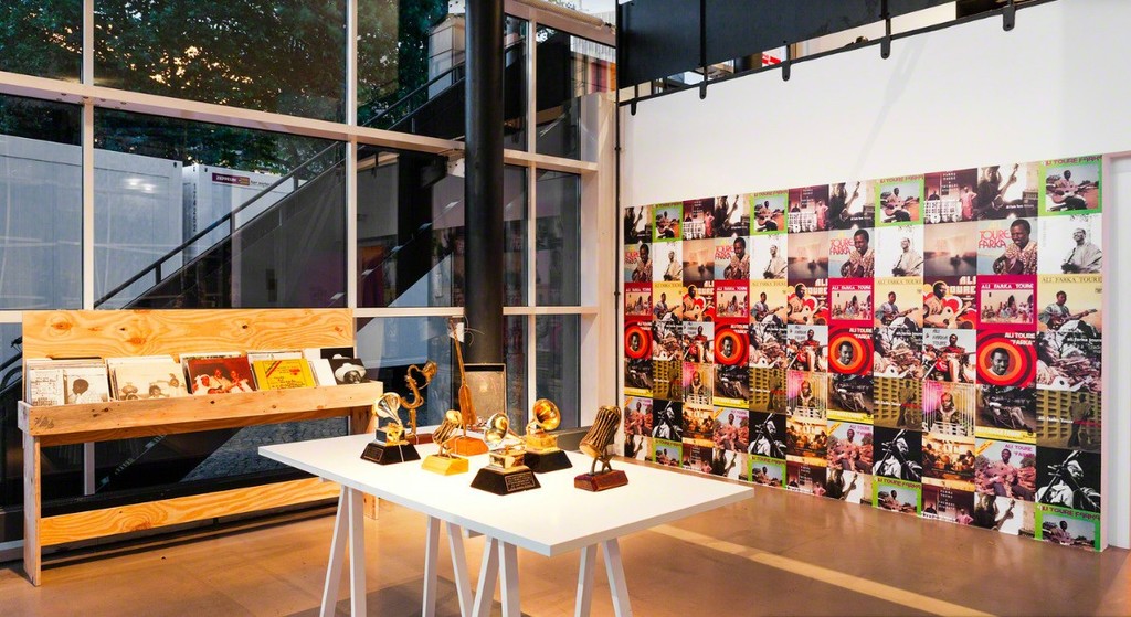 Curated Igo Diarra and Dolly Kola-Balogun, Installation of objects and archival materials related to Ali Farka Toure and his band and concert by the remaining original members (2014/2017), Installation view, documental Halle, Kassel, Documenta 14, Photo: Michael Nast. Curated Igo Diarra and Dolly Kola-Balogun, Installation of objects and archival materials related to Ali Farka Toure and his band and concert by the remaining original members (2014/2017), Installation view, documental Halle, Kassel, Documenta 14, Photo: Michael Nast.