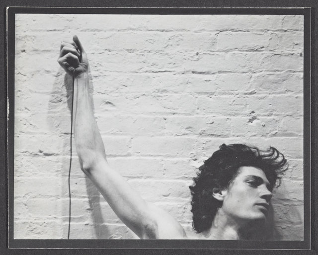 Robert Mapplethorpe, ‘Self-portrait of Robert Mapplethorpe with trip cable in hand’, 1974, J. Paul Getty Museum