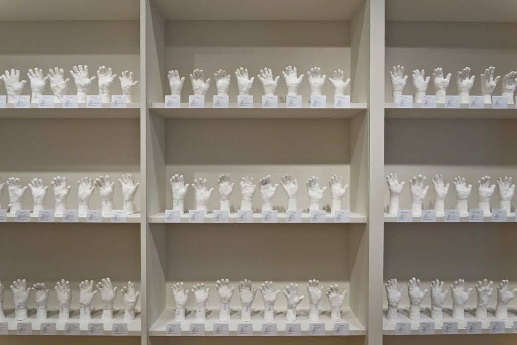 Htein Lin. A Show of Hands, 2013–present. Surgical plaster and multimedia installation. Dimensions variable. Photography by Perry Hu, courtesy of Asia Society Museum. Htein Lin. A Show of Hands, 2013–present. Surgical plaster and multimedia installation. Dimensions variable. Photography by Perry Hu, courtesy of Asia Society Museum.