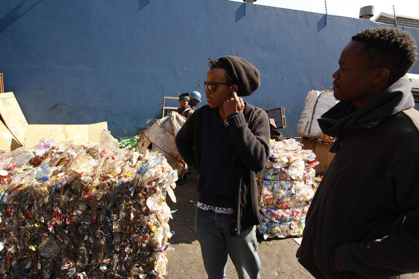 Thabo Pitso at the Scrapyard picking material for his sculptures. Thabo Pitso at the Scrapyard picking material for his sculptures.