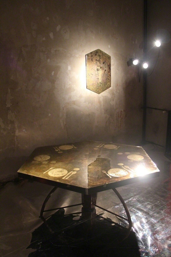 The wall-panel and the "Apparecchiato per sei" table maintain the imperfect hexagonal forms intone with the artists wish to not conform to the banal The wall-panel and the "Apparecchiato per sei" table maintain the imperfect hexagonal forms intone with the artists wish to not conform to the banal