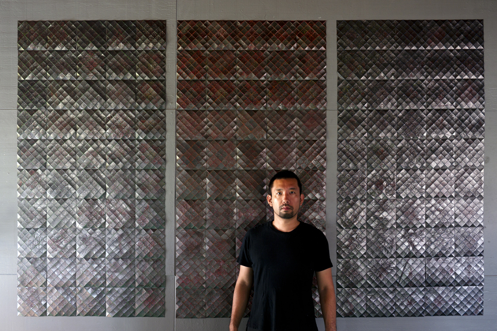 The artist Takayuki Daikoku in front of his major three-partite work 'RGB', 2017, 180 × 283 cm, acrylic, graphite on paper; photo: Takayuki Daikoku The artist Takayuki Daikoku in front of his major three-partite work 'RGB', 2017, 180 × 283 cm, acrylic, graphite on paper; photo: Takayuki Daikoku