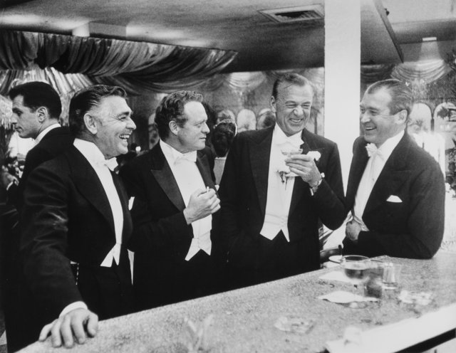 Slim Aarons, ‘Kings of Hollywood: Clark Gable, Van Heflin, Gary Cooper, and James Stewart at Romanoff's in Beverly Hills, California’, 1957, Heritage Auctions