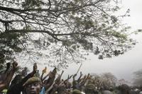Supporters of Jean-Pierre Bemba line the road as he walks to a rally from the airport, Kinshasa, July 2006