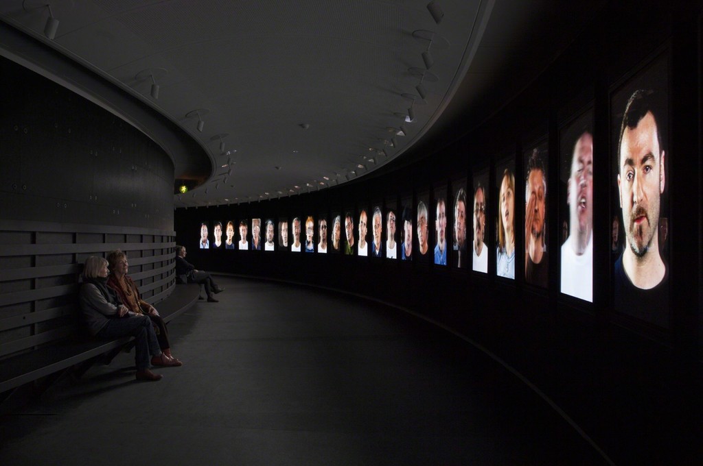 Installation shot of Candice Breitz' Working Class Hero (A Portrait of John Lennon), 2006. 25-channel video installation. From the exhibition Fire under Snow: New film and video works at Louisiana (27.1.-8.5.2016), Louisiana Museum of Modern Art. Installation shot of Candice Breitz' Working Class Hero (A Portrait of John Lennon), 2006. 25-channel video installation. From the exhibition Fire under Snow: New film and video works at Louisiana (27.1.-8.5.2016), Louisiana Museum of Modern Art.